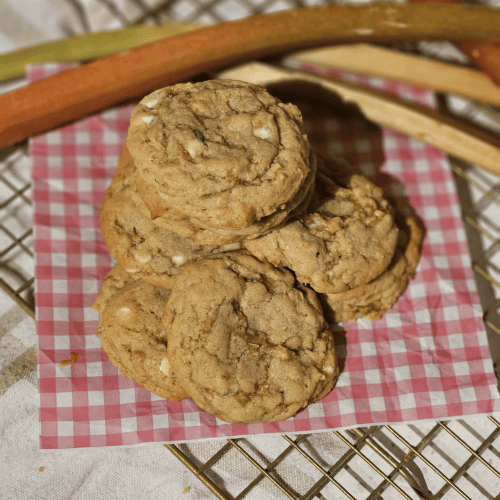 Rhubarb ginger cookies with white chocolate on a red gingham cloth